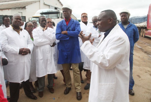 Grain Marketing Board acting general manager Mr Lawrence Jasi addresses members of the Lands, Agriculture and Irrigation Development parliamentary portfolio committee during a tour of GMB Aspindale depot yesterday. — Picture by Shelton Muchena