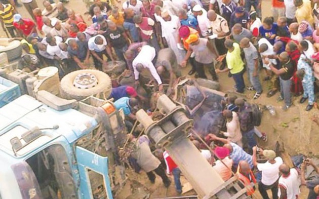 This file photo shows people taking photographs at an accident scene. The dangers of social media do not lie in social media itself. No. These problems lie in the way we use and misuse social media